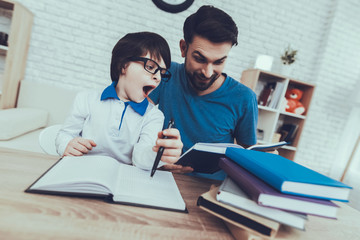 Father is Doing a Homework with Son