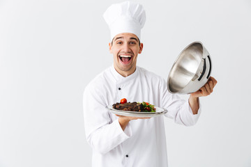 Excited man chef cook wearing uniform