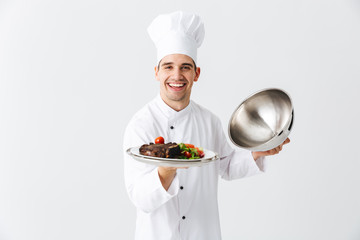 Excited man chef cook wearing uniform