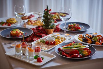 Beautifully served table in a restaurant with lots of salads, appetizers, desserts