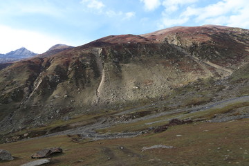 Small lake passing through between the mountains