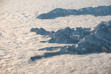 Above of cloudy cluster with rocky mountain