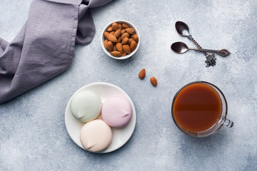 Cup of hot chocolate and marshmallows, almonds on the table.