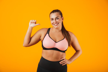 Portrait of a cheerful overweight fitness woman