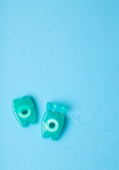 Dental floss on a blue background.