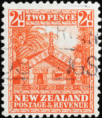 Maori house on vintage new zealand postage stamp