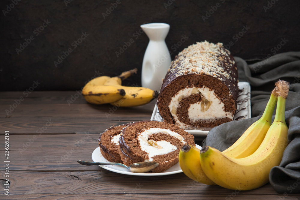 Canvas Prints Homemade chocolate roll cake with mascarpone cream, bananas feeling, decorated with chocolate ant walnuts.