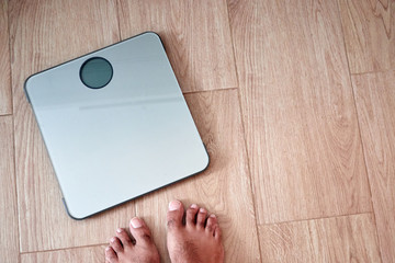 bathroom scale seen in first person man about to weigh himself