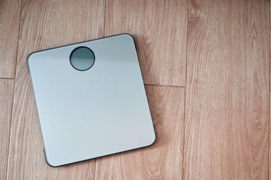 bathroom scale seen in first person man about to weigh himself