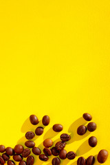 Coffee Seeds Over Yellow Background. Abstract Colorful Background. Food And Drinks Concept.
