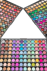 Colorful eyeshadow palettes isolated on a white background. Make-up eyeshadow palettes arranged in form of triangle