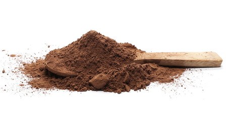 Cocoa powder pile with wooden spoon isolated on white background