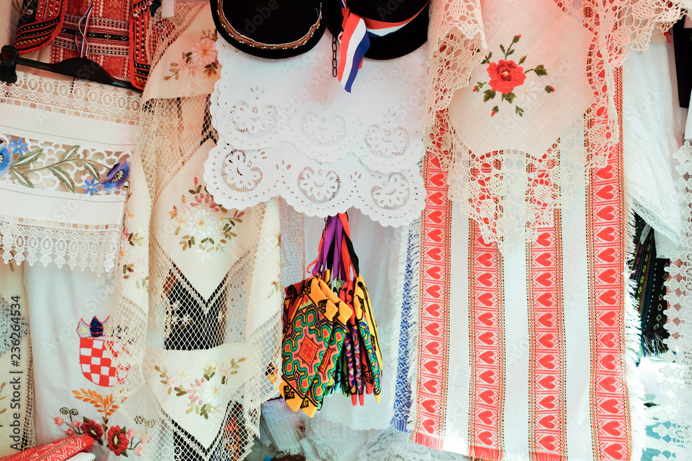 Wall mural Croatian souvenir traditional tablecloths and towels sold at local market