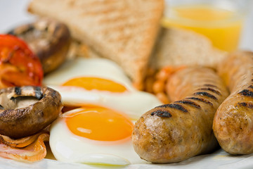 Classic English breakfast served. Close view.