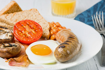 Classic English breakfast served. Close view.