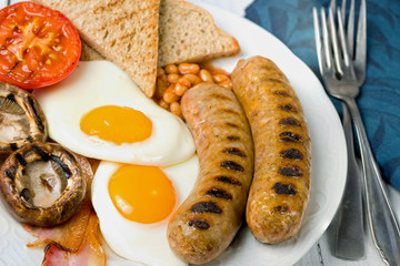 Classic English breakfast served. Close view.