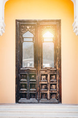 luxury, beautiful, old wooden front door with glare of sun
