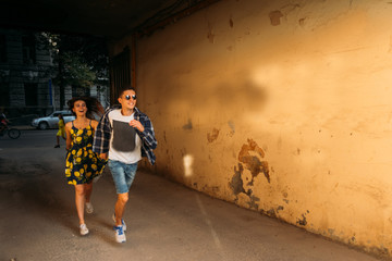 couple in love runs down the street