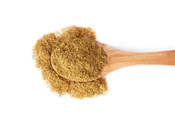 Ground cumin powder in wooden spoon isolated on white background