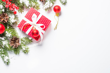 Christmas background with present and decorations on white.