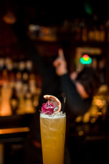 Ready alcoholic cocktail on the background of spice bars in a luxury bar, club, night club, restaurant, pub, evening, weekend