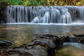 Obraz premium Beautiful of Huai Mae Khamin waterfall at Kanchanaburi, Thailand with tree forest background