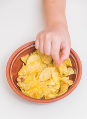 a girl, baby eat potato chips, not healthy food