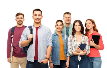 education, high school and people concept - group of smiling students with books over white background