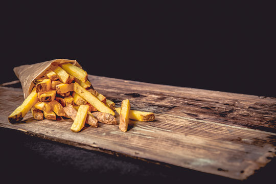 French fries Pommes Frites on Wood Dark