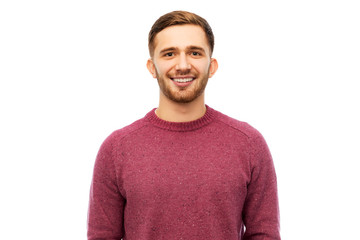 people concept - smiling young man in pullover over white background