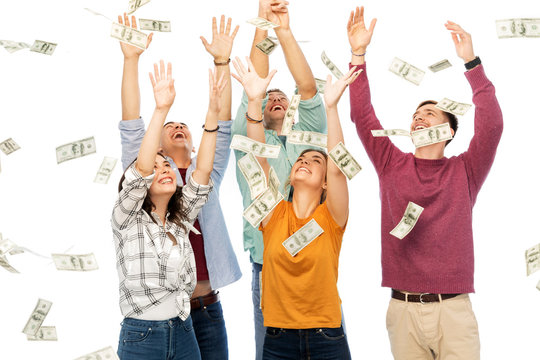 Finance, Wealth And People Concept - Group Of Happy Friends Picking Money Falling From Up Above Over White Background