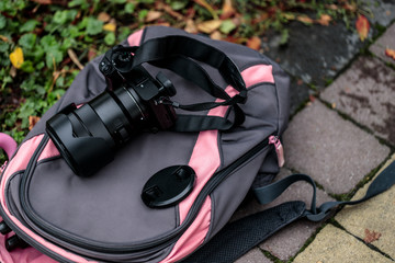 Camera lying on a female backpack