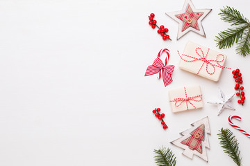 Christmas composition. Wooden decorations, stars on white background. Christmas, winter, new year concept. Flat lay, top view, copy space.