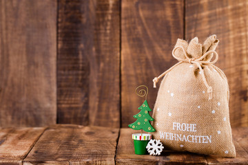 Christmas greeting card wooden background.