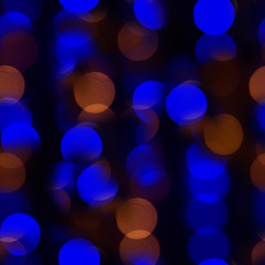 Seamless texture multi-colored lanterns, festive background in blur.