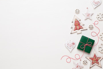 Christmas composition. Wooden decorations, stars on white background. Christmas, winter, new year concept. Flat lay, top view, copy space.