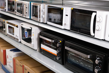 Image of assortment of a kitchen microwave at household  appliances store