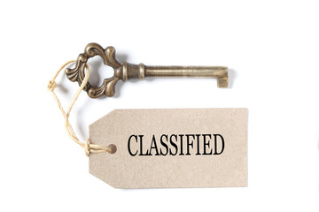 old antique key, a label  with the word success isolated on white background with copy space