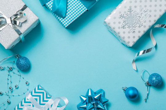 Christmas background - presents and decorations in silver and blue, top view