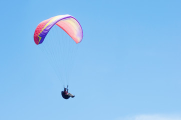 Paraglider against the sky. Russia, Republic of Crimea. 06.13.2018. Flight of a paraglider athlete against the sky