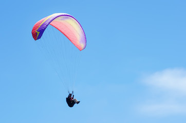 Paraglider against the sky. Russia, Republic of Crimea. 06.13.2018. Flight of a paraglider athlete against the sky