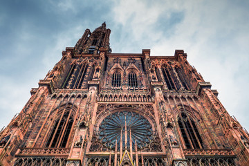 Huge tower and elegant exterior architecture of Notre dam of Strasbourg cathedral in Strasbourg, France - obrazy, fototapety, plakaty