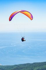Paraglider over the sea coast. Russia, Republic of Crimea. 06.13.2018. Flight of a paraglider...