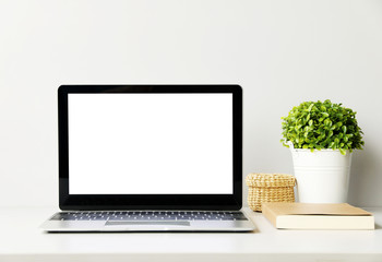 Fototapeta premium front view tablet,glasses,Watch,plant on office desk.with copy space.