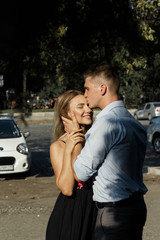 happy, loving couple hugging. guy kisses girls, protection. protects