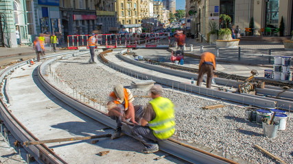 Repair works on the street timelapse. Laying of new tram rails on a city street