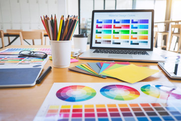 Graphic designer object tool and color swatch samples at workspace