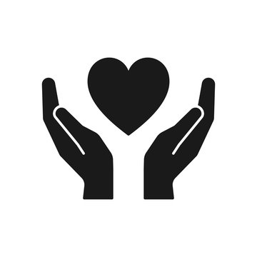 Black isolated icon of heart in hands on white background. Silhouette of heart and hands. Symbol of care, love, charity.