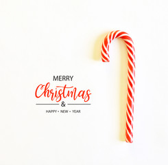 Merry Christmas and Happy New Year. Candy cane isolated on white.