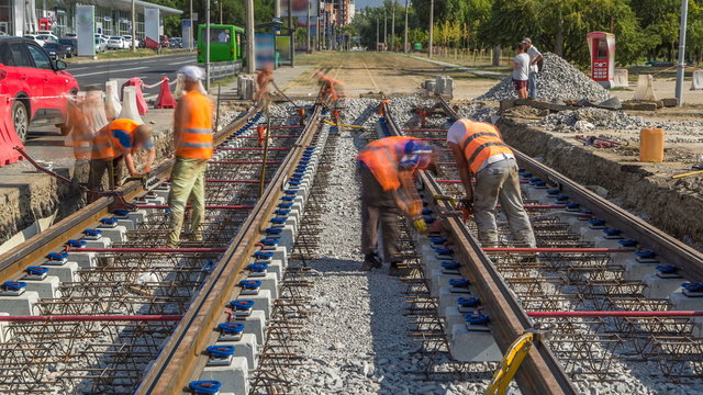 Repair works on the street timelapse. Laying of new tram rails on a city street